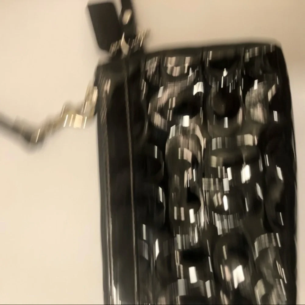 Coach embossed black leather wristlet clutch bag